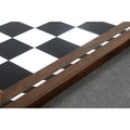 Detail shot of the polished Golden Rosewood border and decorative inlay on the library chess board.