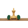 White boxwood King piece showcasing the green felted base for surface protection and stability.