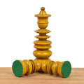 Antiqued boxwood chess pieces illustrating the protective green felted base padding.