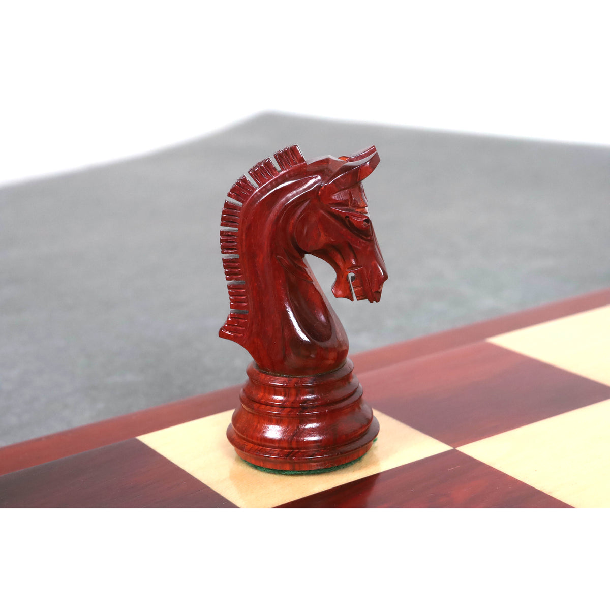 Close-up profile of a carved bud rosewood knight from the 3.8" Imperial Staunton chess set.