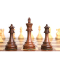 Weighted golden rosewood Staunton King positioned between two extra Queens on a chessboard.