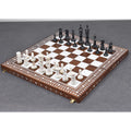 Hand-carved British series camel bone chess set on a luxury inlaid wooden board.