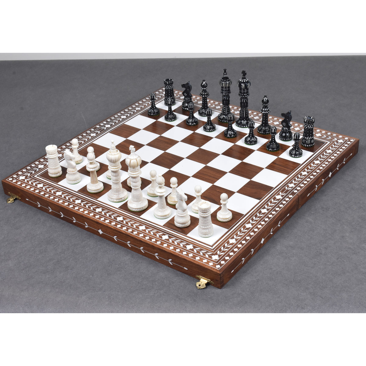 Hand-carved British series camel bone chess set on a luxury inlaid wooden board.