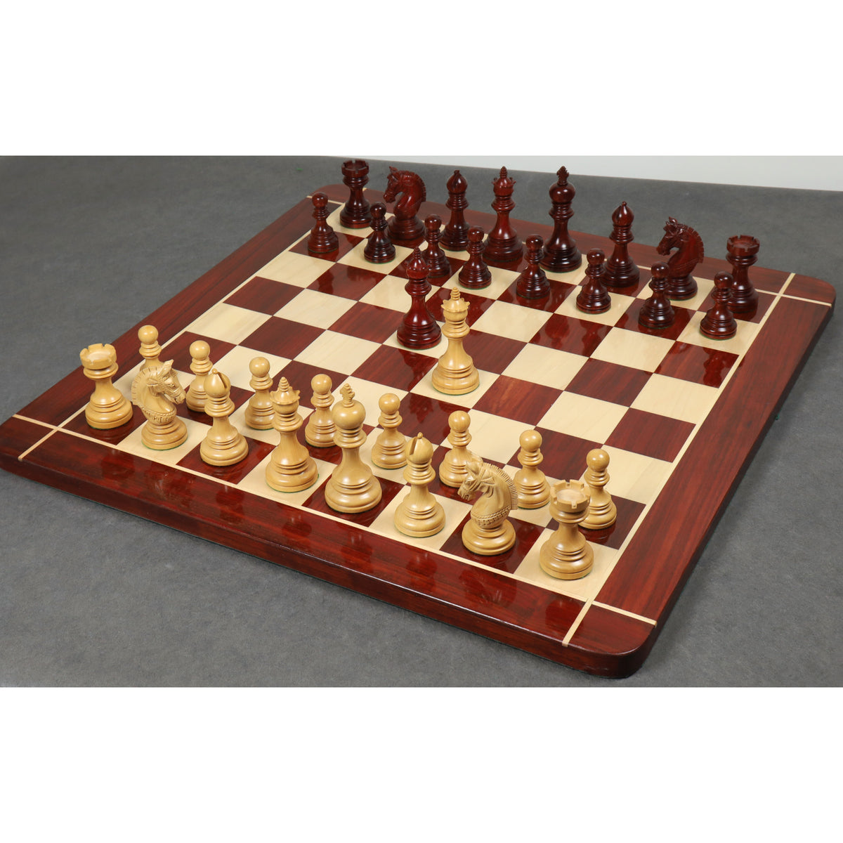 Complete Stallion Staunton chess set arranged on a wooden board.