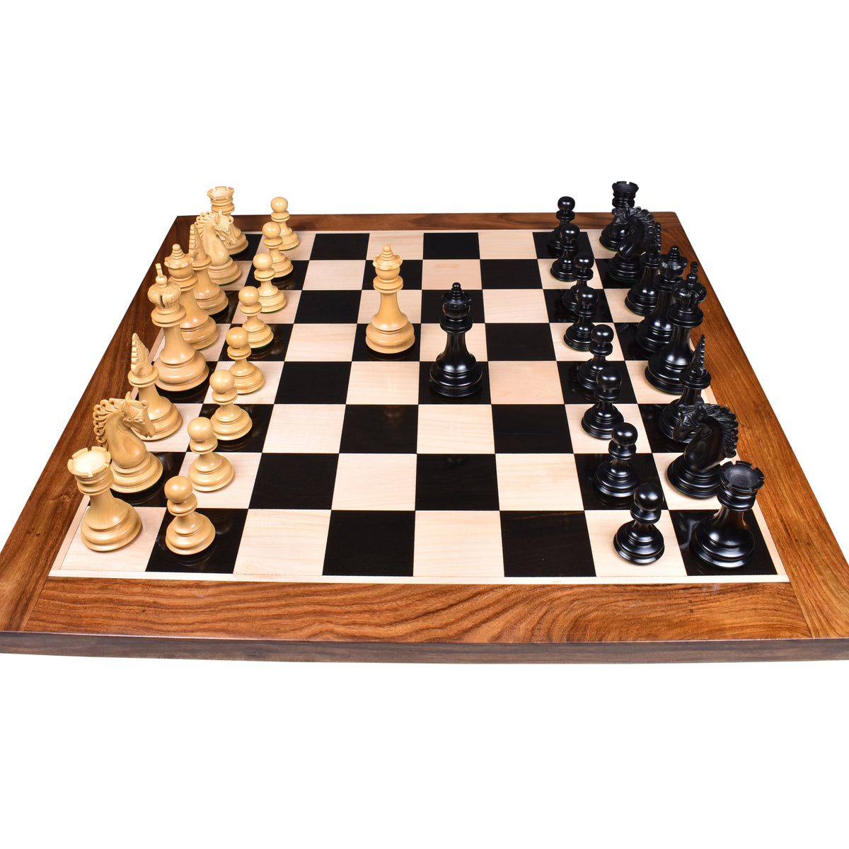 Full premium Carvers Art ebony wood and boxwood chess set arranged on a luxury wooden board.