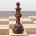 Close-up of a 3.4-inch Golden Rosewood Meghdoot Staunton chess King on a board.