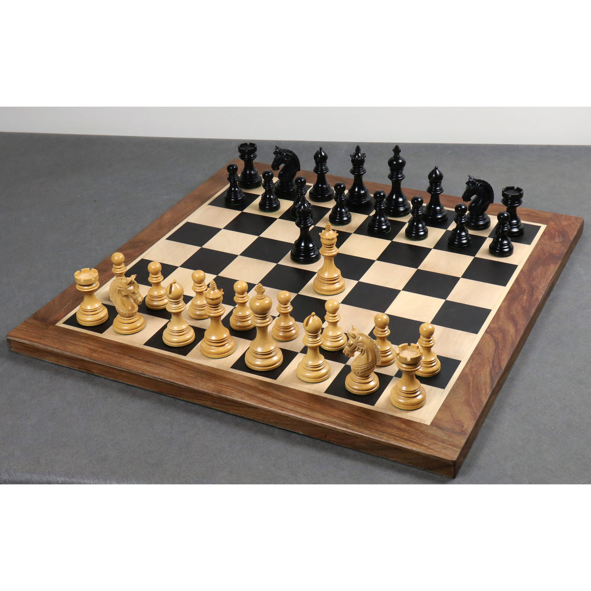 A full Stallion Staunton luxury chess set displayed on a wooden board.