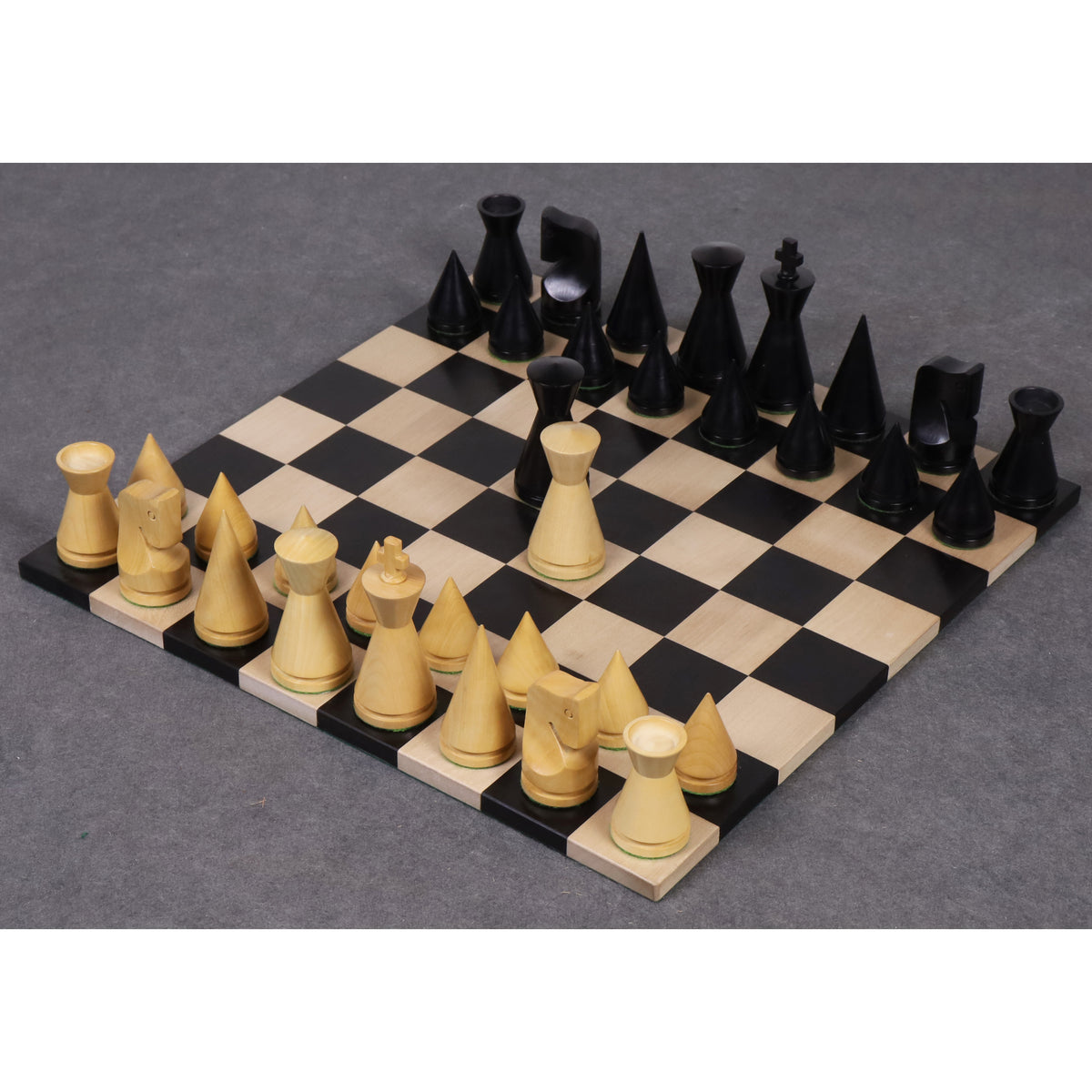 Full 3.1 inch Russian Poni minimalist chess set displayed on a premium black and maple wood chessboard.