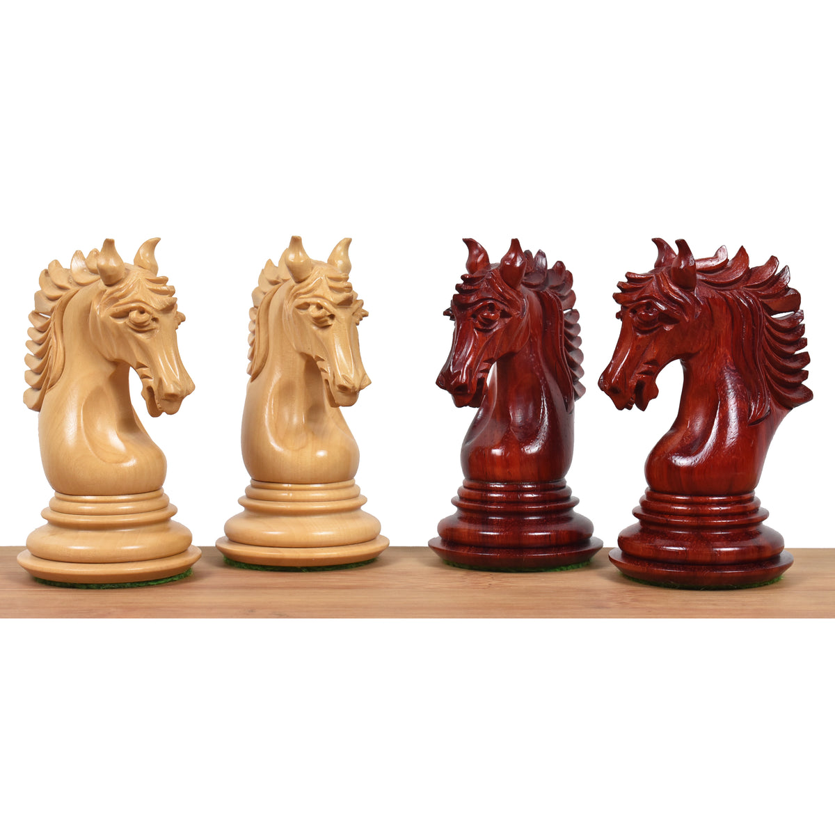 Hand-carved Arthur series knights in boxwood and Bud Rosewood for luxury chess sets.