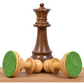 Golden rosewood French Grandmaster queen piece with two boxwood pieces showing felt bases.