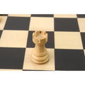Weighted natural boxwood rook from the Zagreb series showcasing the crenellated top and smooth finish.