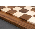 Macro view of the seamless joinery and natural wood texture of the Golden Rosewood and Maple chess board.