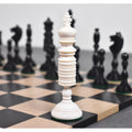 Close-up of a white antique pre-Staunton king piece on a wooden chessboard.