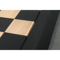 Detailed view of the precision wood inlay craftsmanship on an ebony and maple wood chessboard.