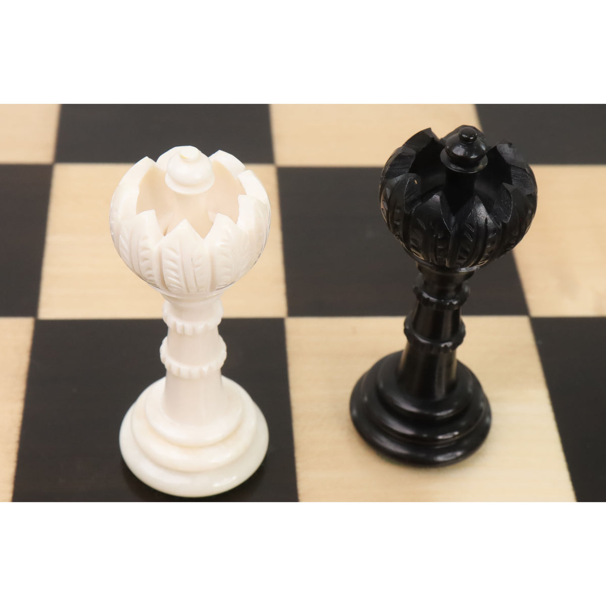Detailed top view of black and white Turkish Tower queen chess pieces