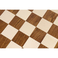 Detailed texture shot of the 55mm Maple and Golden Rosewood chess squares with a natural matte finish.