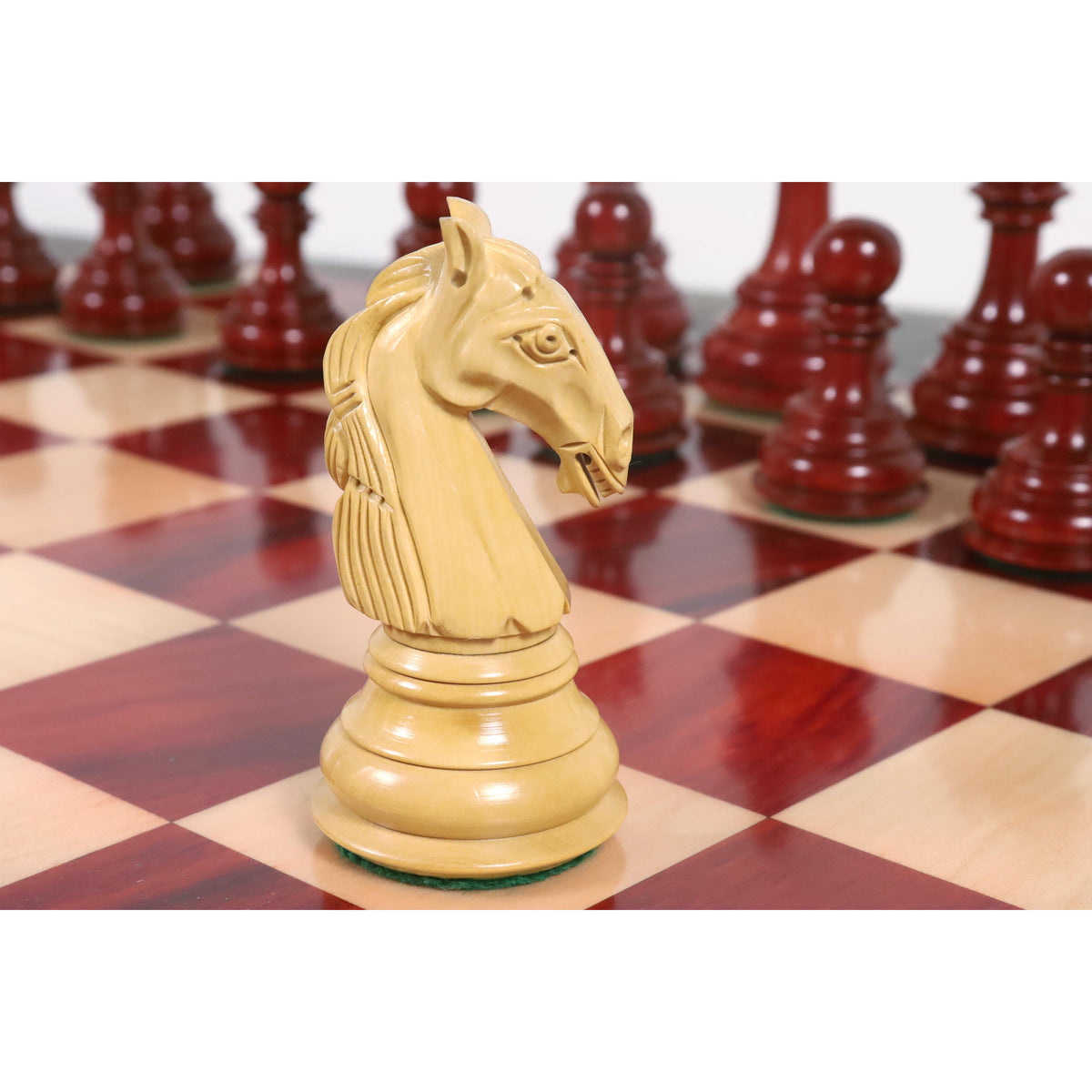 Detailed side view of a carved boxwood knight from the Columbian chess set.