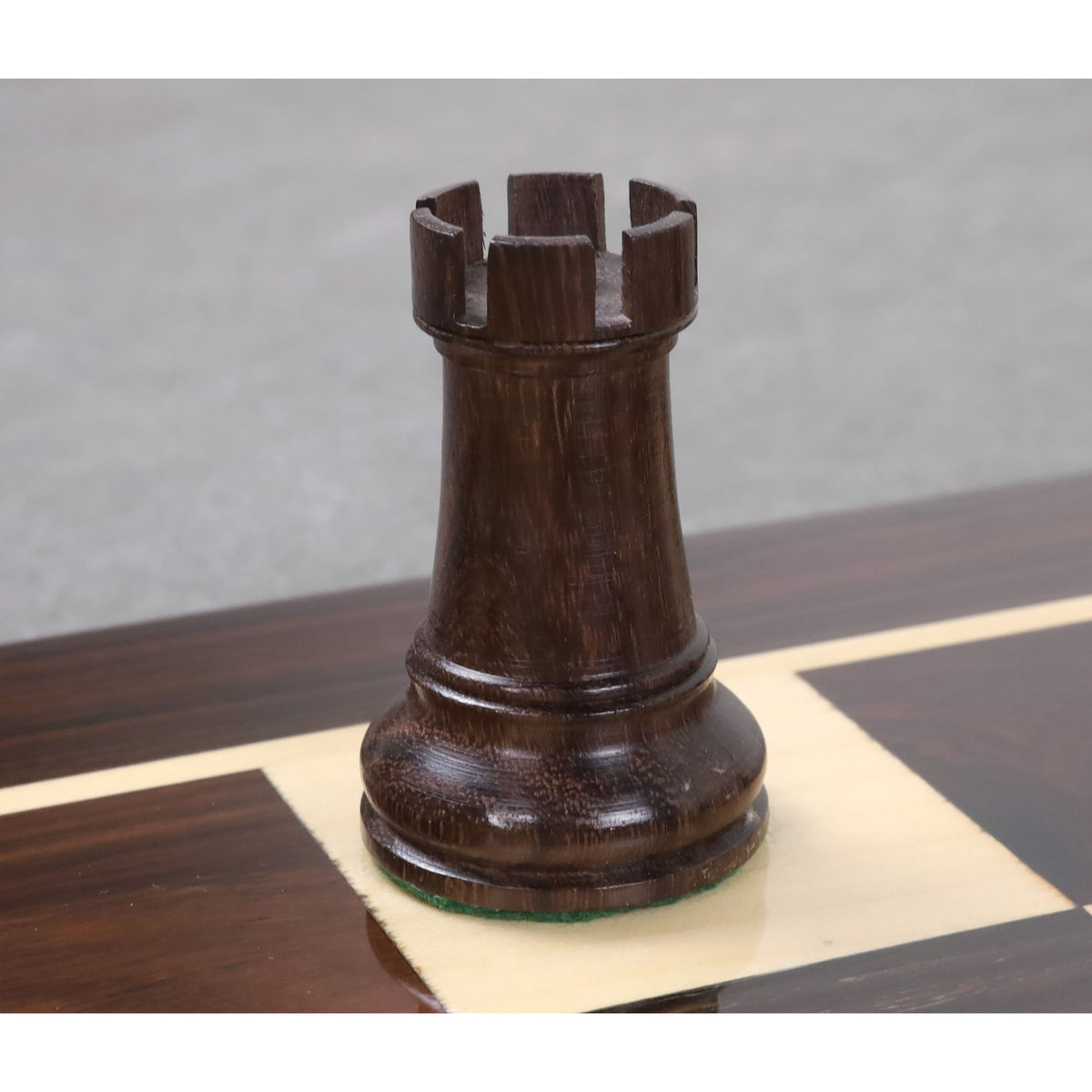 Intricately carved rosewood rook piece, part of the Leningrad Staunton collection.