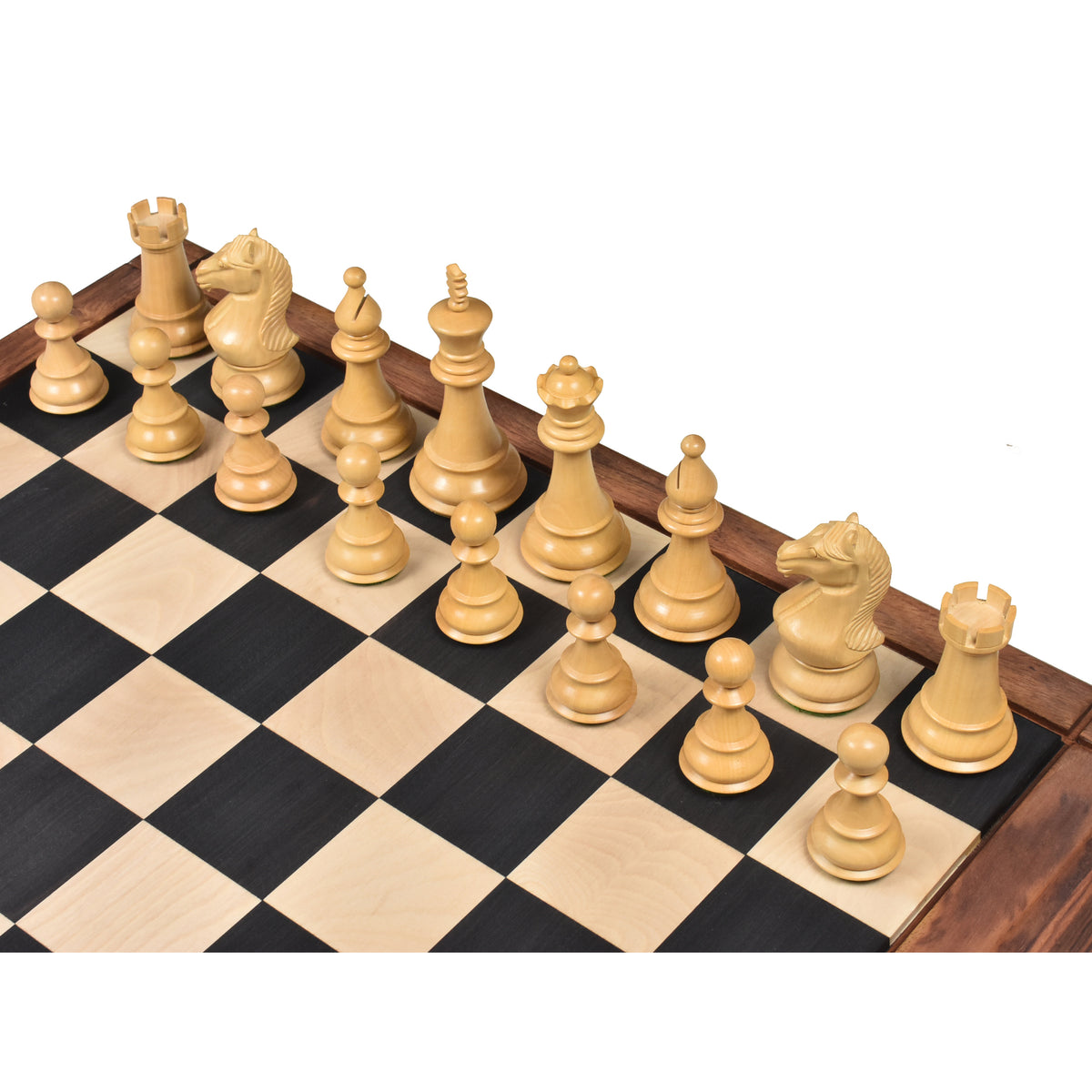 Side angle of natural boxwood Majestic Series chess pieces arranged on a wooden board.