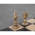 Dark bishop and rook pieces from the 3.7" English Series Pre-Staunton antique camel bone chess set on a wooden board.