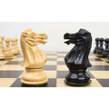 White and black knights from the 3.7" British Staunton weighted chess set facing off on a chessboard.