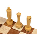 Premium natural boxwood king, queen, and bishop pieces from the Berliner minimalist collection on a board.