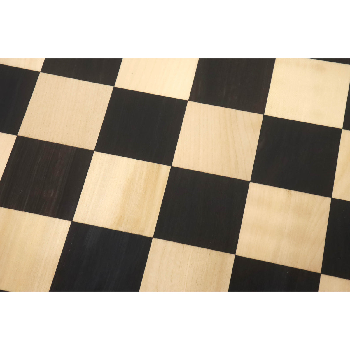 Detailed texture of the 55mm solid Ebony and Maple wood squares on a tournament-size chess board.