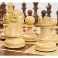 Close-up of a boxwood knight and rook from the Reykjavik Series Staunton chess set on a board.