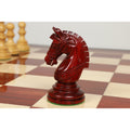 Detailed side view of a dark bud rosewood Staunton knight piece.