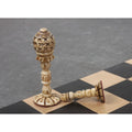 Standing dark queen and a resting pawn showing the red felt base from the English Series Pre-Staunton camel bone set.