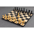 Professional Staunton chess set pieces arranged on a wooden chessboard.