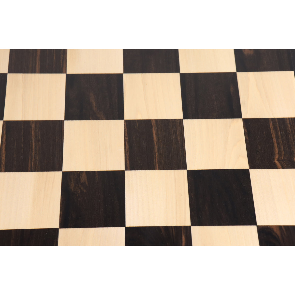 Overhead view of 57mm square ebony and maple wood chess board squares.
