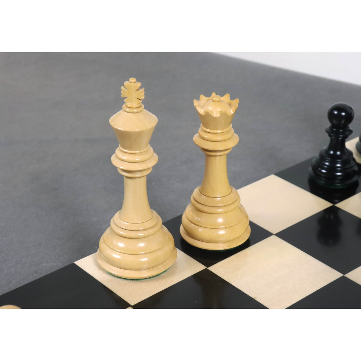 Elegant white King and Queen chess pieces from the set.