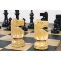 Close-up of two natural boxwood W.T. Pinney Staunton knights with carved manes positioned on a chessboard.