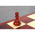 Solitary dark bud rosewood pawn from the 3.8" Imperial Staunton chess set resting on a board.