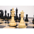 Close-up of white Spartacus luxury Staunton king and queen chess pieces on a board.