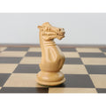 Side profile view of a wooden white Staunton knight chess piece.