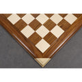 Overhead corner detail of the hand-carved border and mitered joints on a premium Golden Rosewood chessboard.