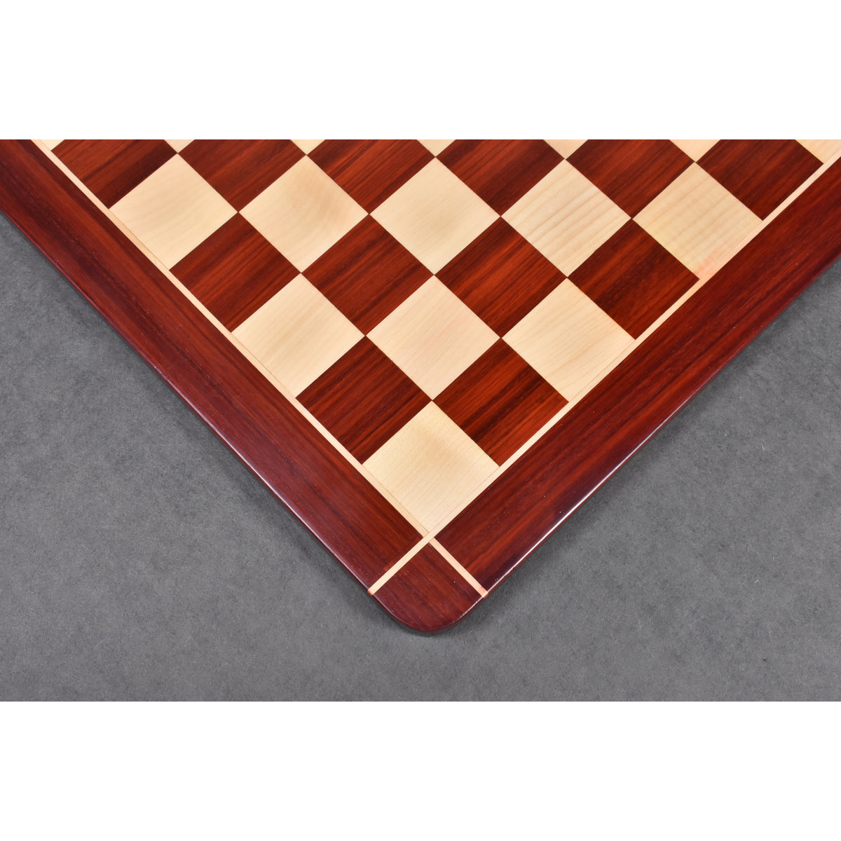 Detailed side-angle view of the premium Bud Rosewood and Maple chess board, emphasizing the elegant signature border inlay.