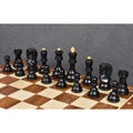 Ebonized wood Russian Zagreb chess pieces arranged on the ranks of a chessboard.