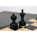 Black ebonised King and Queen pieces from the Library Series showing fine wood grain and polish.