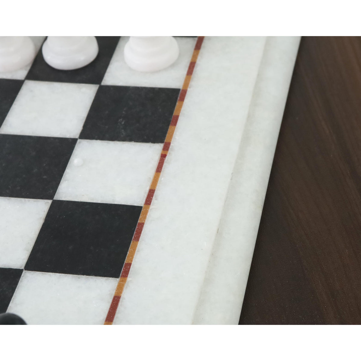 Detailed edge and inlay of the 12-inch handcarved marble chess board.