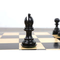 Polished ebony wood Bishop chess piece showing the traditional Staunton style miter.