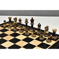 Burnt boxwood Parker Staunton chess pieces beautifully displayed on a polished black and maple chessboard.