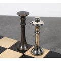 Close-up of the 3.1 inch Tower Series brass luxury chess pieces showing the King and Queen side by side.