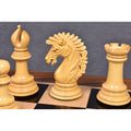Close-up of light wood Mogul Staunton chess pieces.