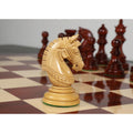Detailed side view of a light boxwood Staunton knight piece.