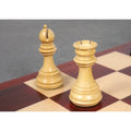 Light boxwood bishop and rook from the Imperial Staunton chess pieces resting on a chessboard.