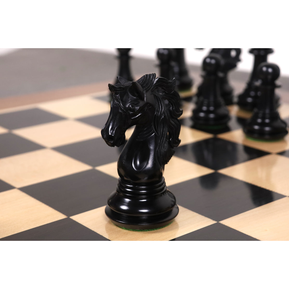 Detailed side profile of a hand-carved black ebony Spartacus luxury Staunton knight piece.