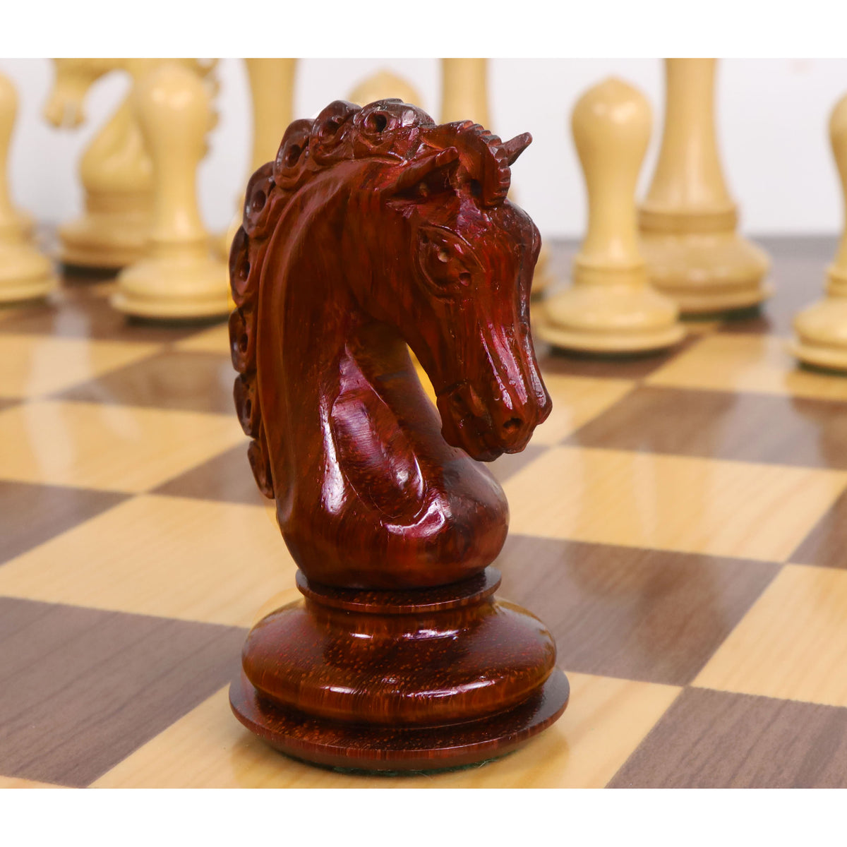 Handcrafted bud rosewood knight chess piece from the Avant Garde Staunton set.